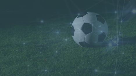 animación de la red de conexiones sobre el jugador de fútbol con el fútbol en el campo.