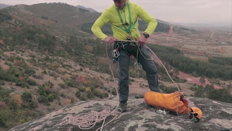 climber preparing a rope for climbing