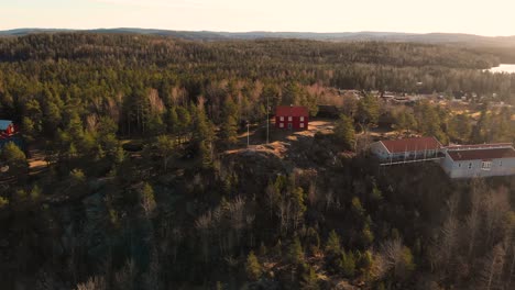 aerial flyover gammelgarden open air museum in bengtsfors during sunset