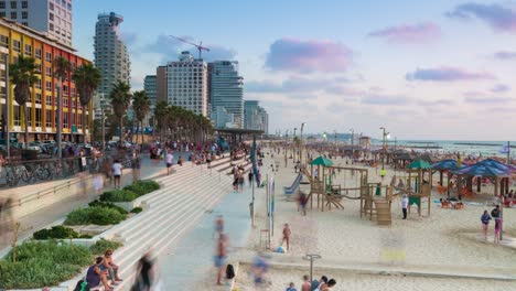 night to day time lapse of people at tel aviv coastline, israel