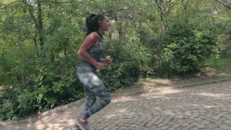 girl running up stairs in a park