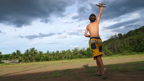 children playing with a toy airplane outdoors