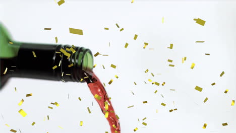 animation of confetti over pouring red wine on white background
