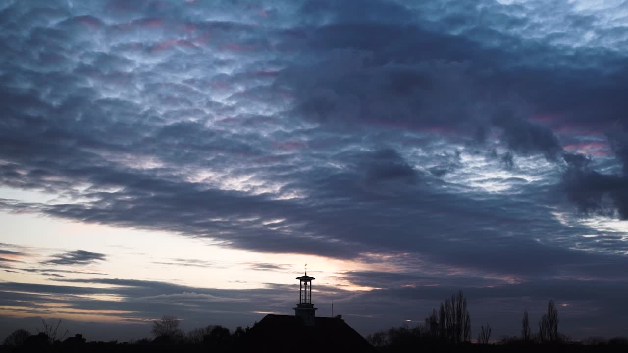 altocumulus navy blue cloud forming sunset sky time lapse silhouette clock tower