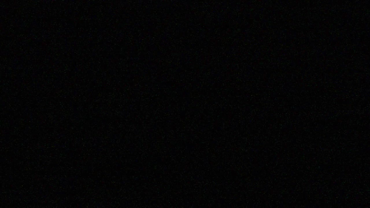 VHS defects, artifacts and noise. Glitches of old damaged tape cassettes. Static TV noise. Retro vintage background. 4K Loop Overlay Screen mode footage