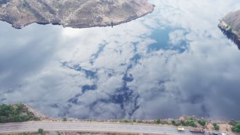 Loch-Lochy-in-Spean-Bridge-Scotland,-aerial-drone-of-glass-like-water-reflection