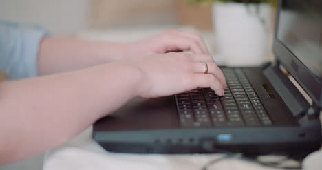 young businesswoman typing response to client email woman typing on keyboard