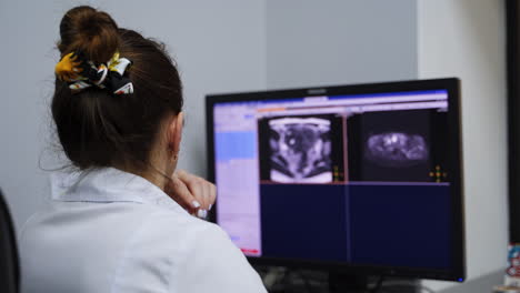 doctor reviewing medical images on computer