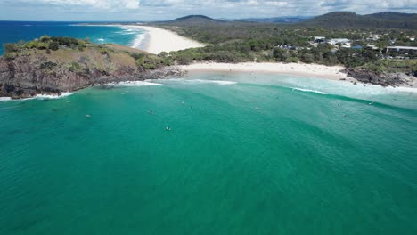 norries head and cabarita beach with surfers in new south wales, australia - aerial shot