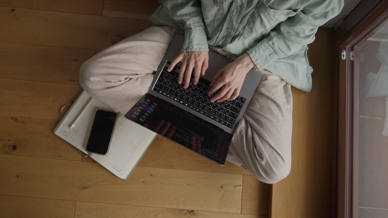 Woman working on laptop at home