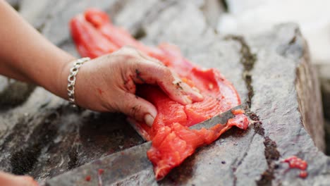 Cutting,-cleaning,-and-gutting-a-wild-salmon-with-a-knife