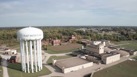 flint, michigan water tower and treatment plant with drone video moving forward