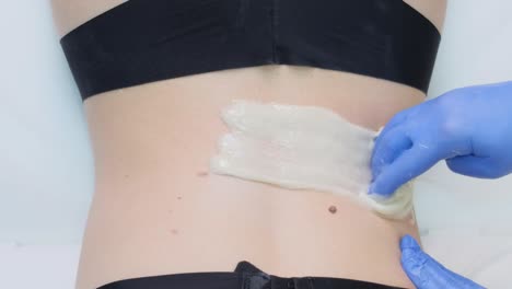 woman getting back waxing