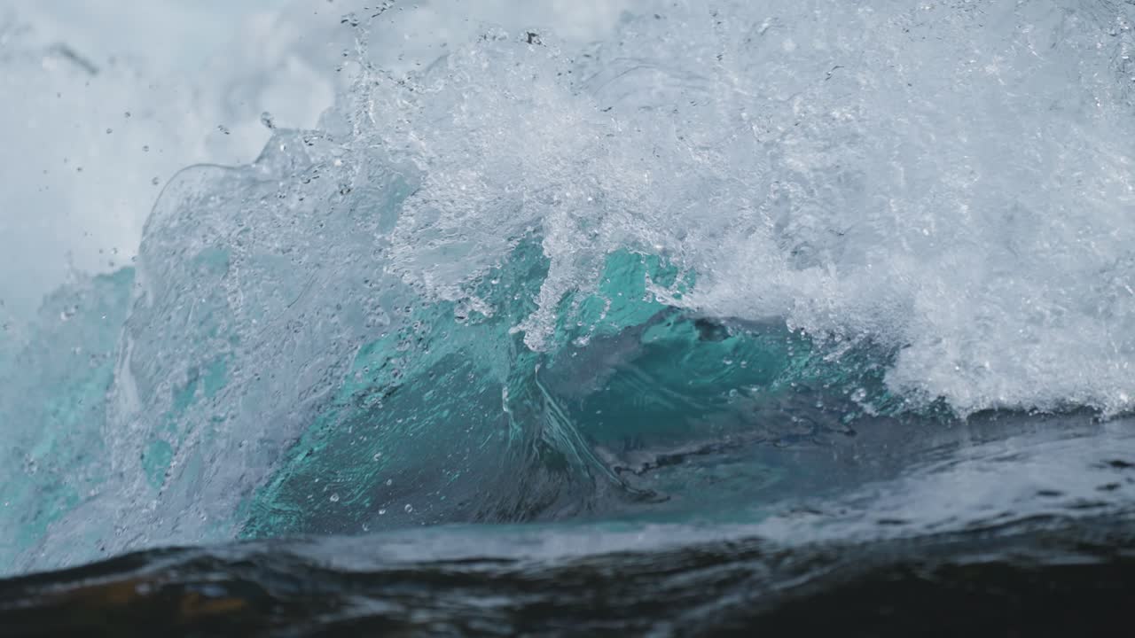 Slow-motion immersion into crashing water's intricate movement
