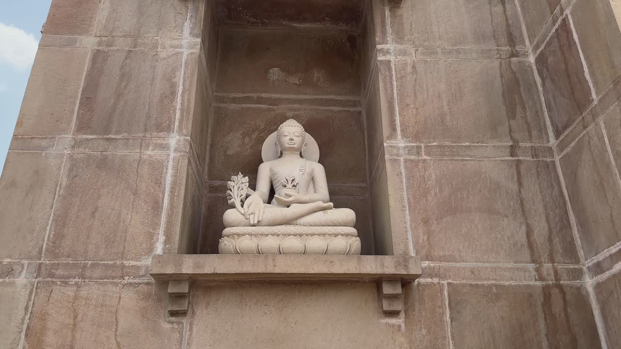 push in shot of stone statue of buddha at sarnath
