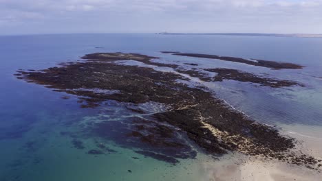 drone shot of the islands beyond gress beach at low tide on the outer hebrides of scotland