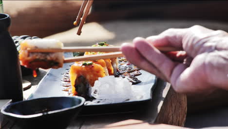 eating sushi in asia with chopsticks