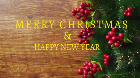 animation of merry christmas and happy new year text with berry and leaves on table