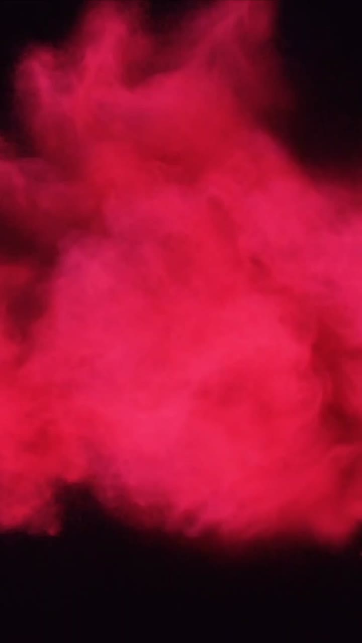 Dynamic Red Smoke Expanding and Dissipating on Black Background