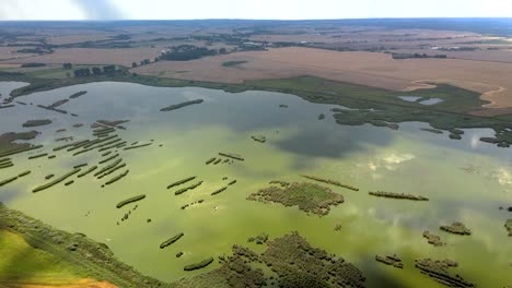 aerial shot of the farm fields and wetlands right before the storm