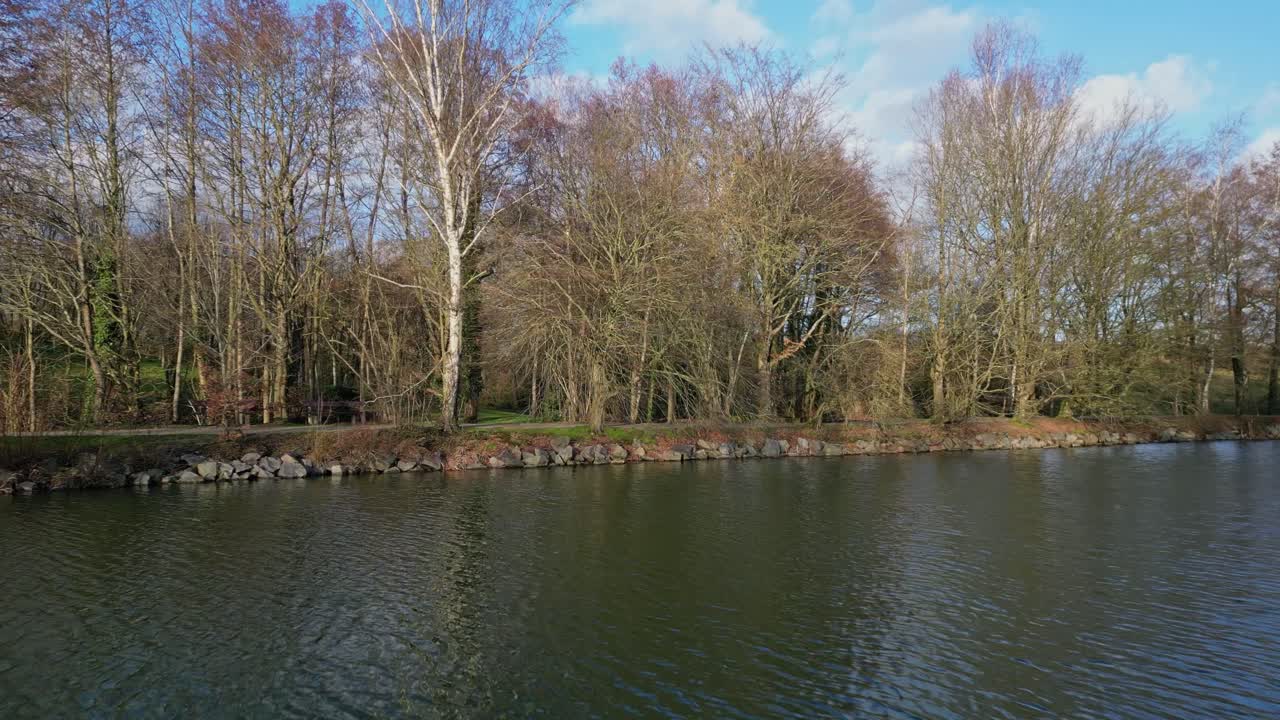 Drone flying over Chateaugiron pond waters, Brittany in France
