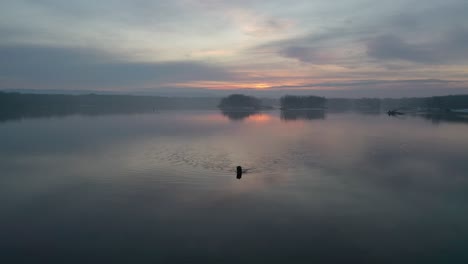 sunrise or sunset over a calm river