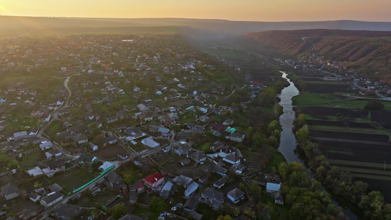Aerial drone view of Orhei, Moldova and the Raut river at sunset