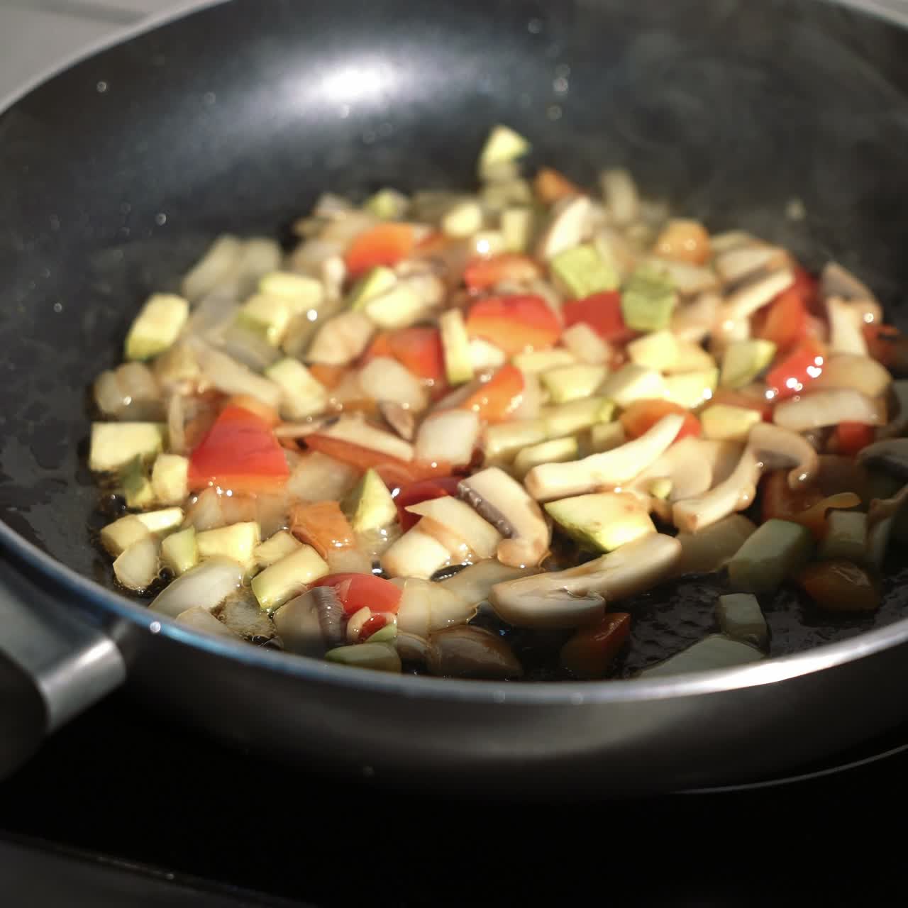 Stewed sliced vegetables in pan