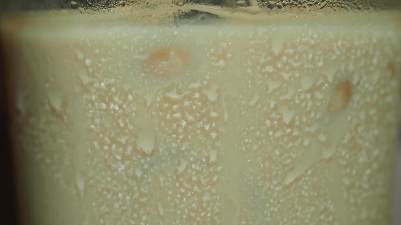Close-up of condensation on a glass containing a cold liquid