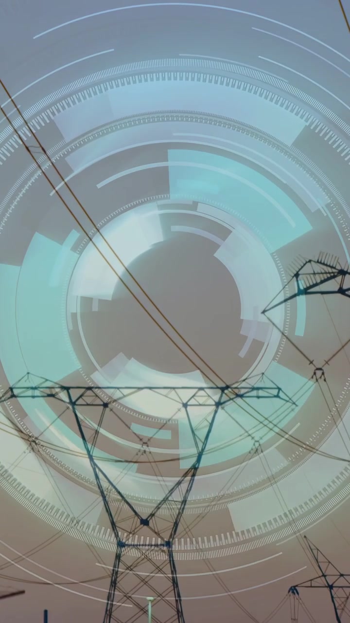 Video verticale: Pilone elettrico principale che si innalza mentre l'HUD attiva anelli rotanti che mappano le linee della griglia