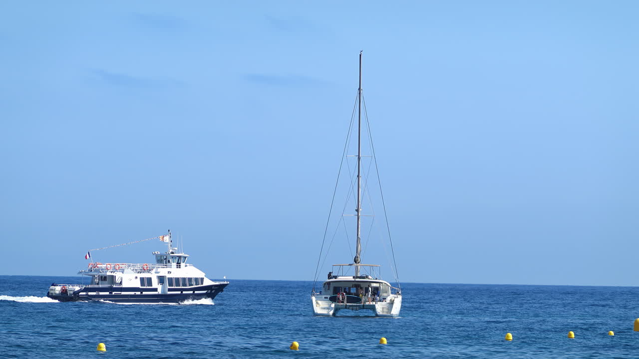 White boats moving on the sea in Cannes, France