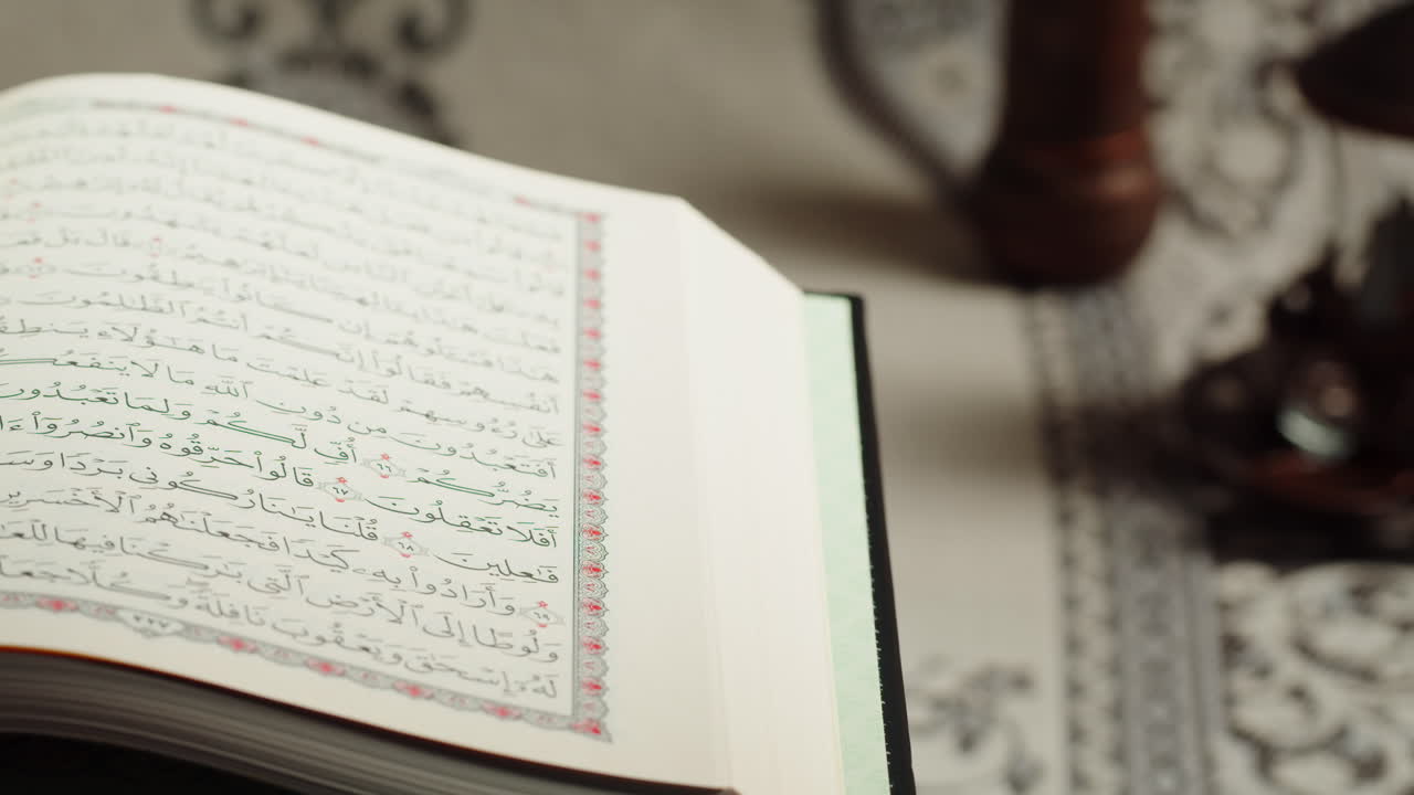 Quran book close-up, praying, islamic religion. Religious holiday Ramadan, holy month. Worship, making traditional prayer to God