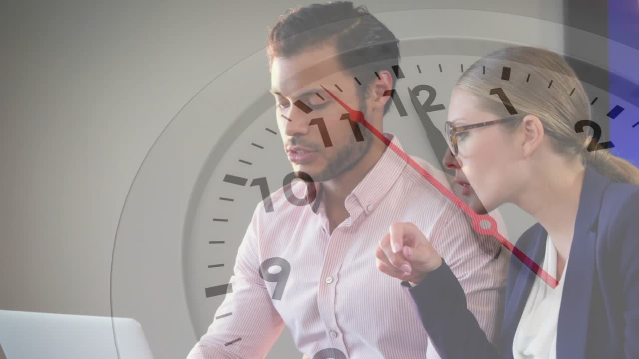 Coworkers scanning laptop with clock overlay in business, after woman pointing screen man nodding