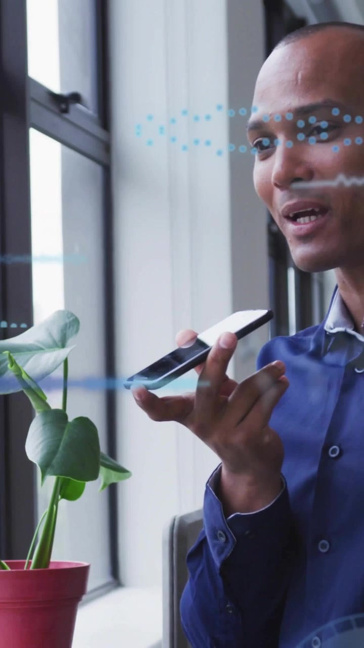 Vertical video: Man holding phone near mouth, speaking on business call with blue waveforms pulsing