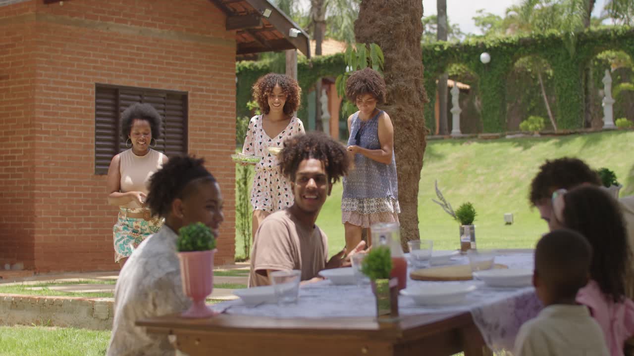 Joyful Outdoor Family and Friends Gathering for a Meal