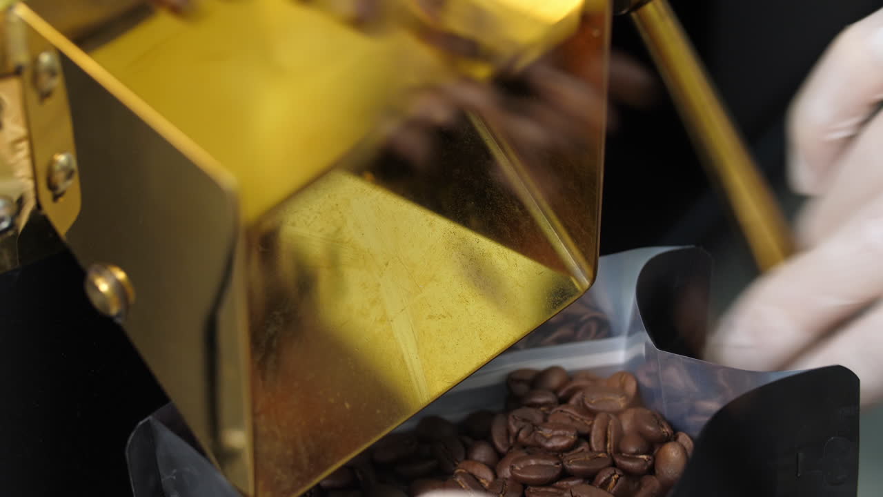 Man'S Hand Filling Coffee Beans In Bag