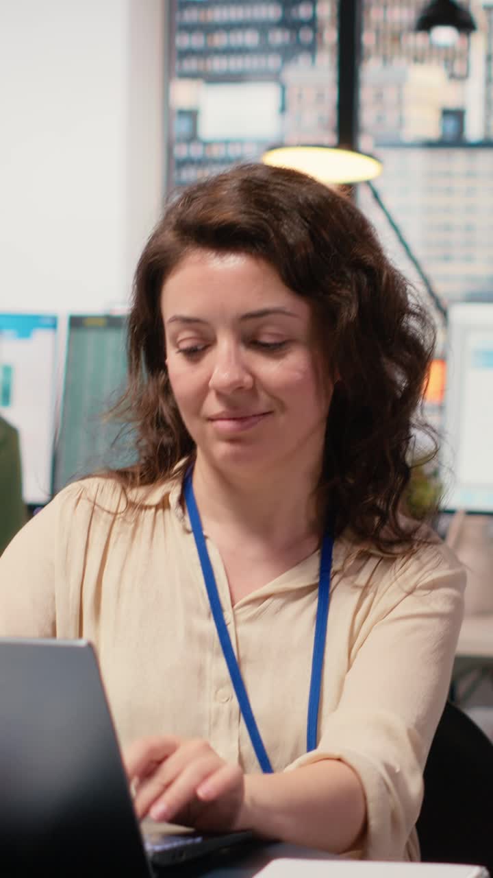 Vertical Video Businesswoman evaluates key performance metrics and writes reports