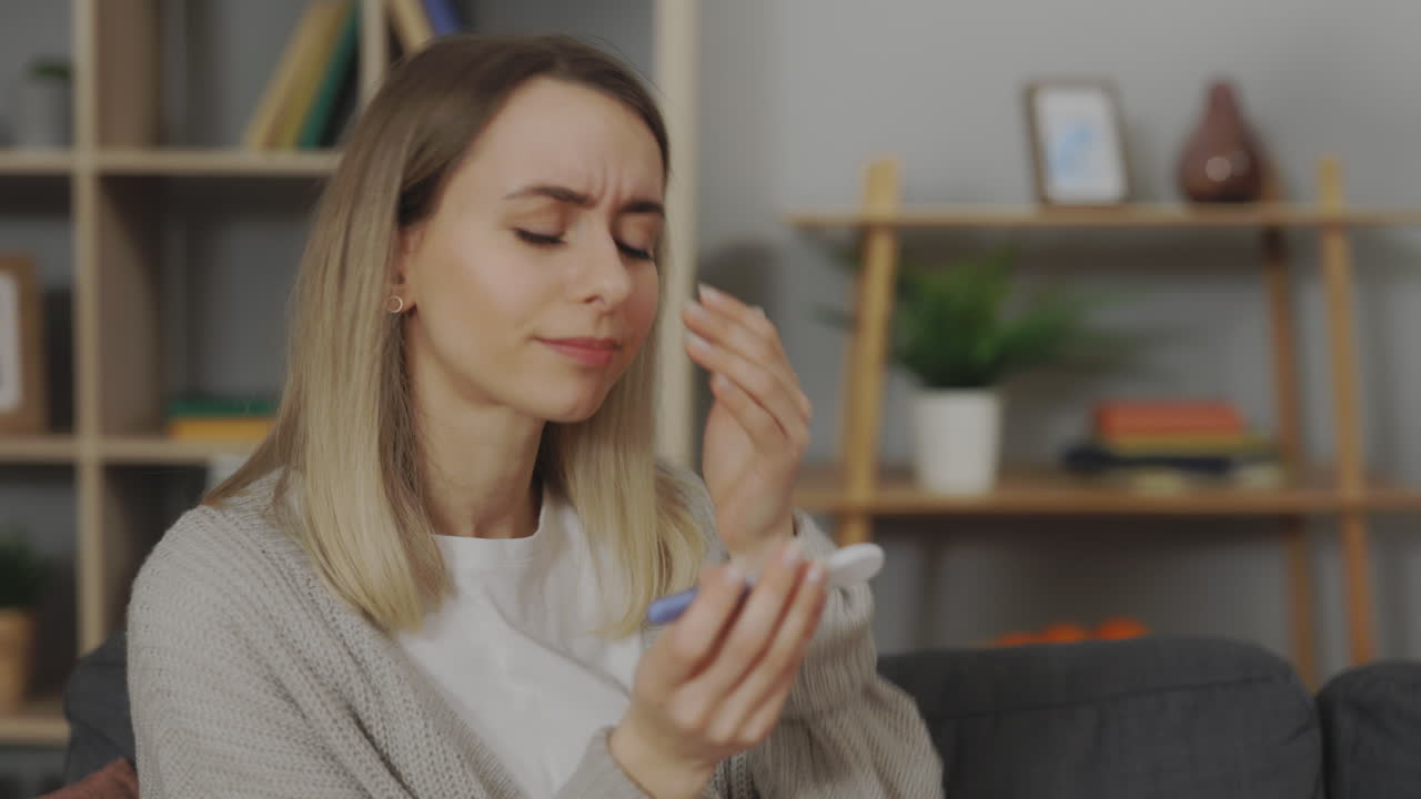 Woman reacts to a negative pregnancy test