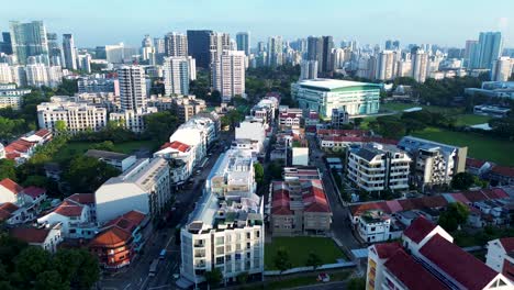 Aerial-drone-landscape-of-city-CBD-skyline-with-residential-housing-commercial-shops-buildings-city-towers-urban-architecture-Farrer-Park-Singapore-Asia