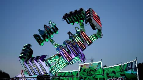 rotating carnival ride against a clear sky