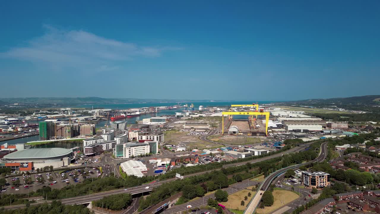 Advancing aerial GV of Harland and Wolff cranes in Belfast City Centre, Northern Ireland, UK on a bright and sunny day. Produced in 4K, 60FPS and with Rec709 color