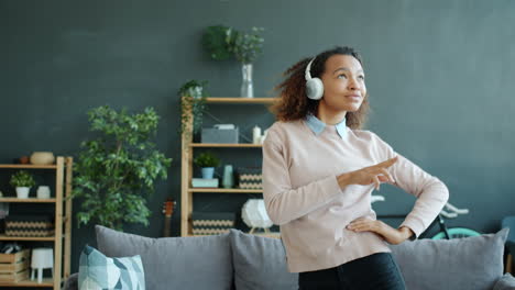 happy woman dancing at home
