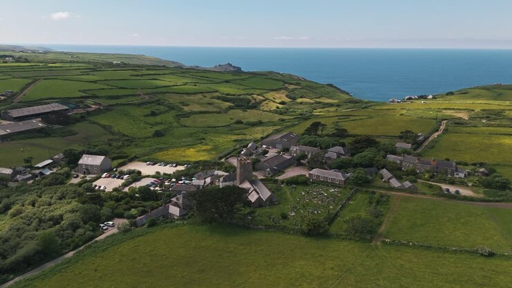 Drone circles left over rolling hills and cliffs near Zennor village on Cornwall’s scenic coastline