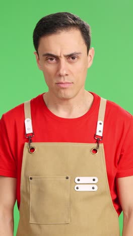 self-employed person smiling at camera on green screen background