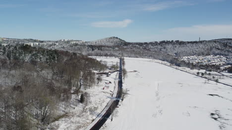 Kviberg-Park-Football-Fields-Covered-in-Snow,-Gothenburg,-Aerial