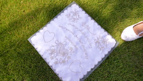 bride accessories sitting on top of a green field