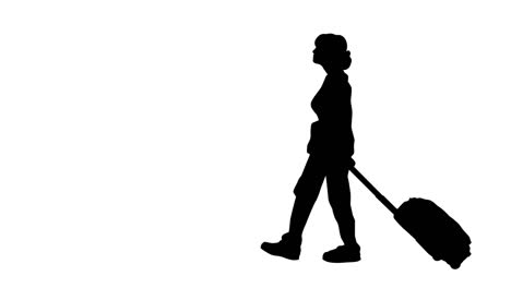 woman with wheelie suitcase in silhouette.