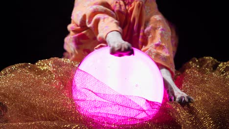 close up dog paws fortune teller using crystal ball