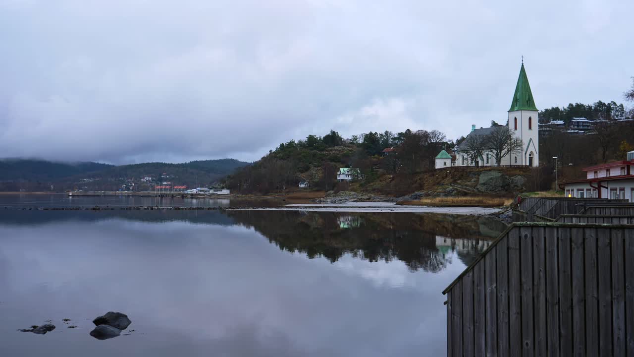 Lakeshore Church Of Ljungs Kyrka In Ljungskile, Bohuslan, Sweden. Wide Shot