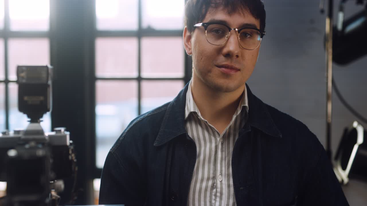 Photographer takes photo in studio.